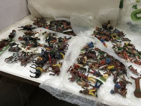 A collection excess of 100 Playworn metal figures