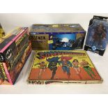 A collection of 4 superhero toys . Super adventure