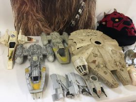 A collection of both vintage and modern playworn Star Wars vehicles and figures plus other items