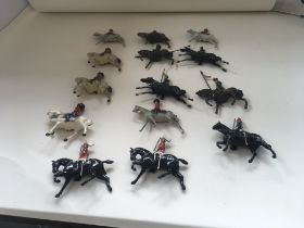 A collection of 14 lead figures by Britains and ot