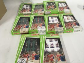 A collection of 10 boxed Subbuteo football teams.