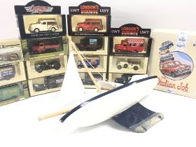 A Box Containing Various Lledo Diecast. Corgi Classic. Models of Yesteryear Etc. And a small sail