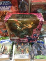 A Collection of Modern He-Man Figures and Toys box