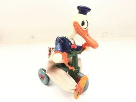 A Paradice Novelty Windup Donald Duck Riding A Tri