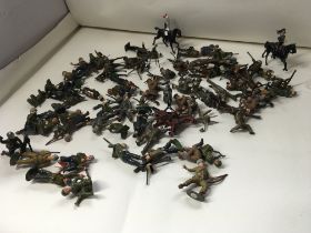 A collection of approximately 50 metal soldier fig