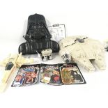 A collection of Star Wars figures and toys. Figure