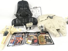 A collection of Star Wars figures and toys. Figure