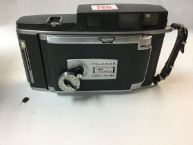 A Polaroid 900 electric eye land camera.