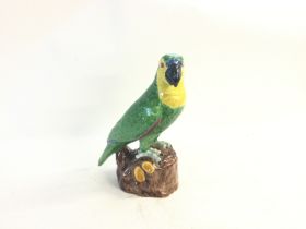 Porcelain parrot statue. Plinth also porcelain. No