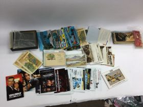 Collection of postcards and vintage London maps.