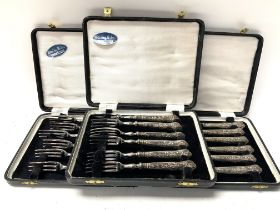 3 cased sets of sterling silver cutlery.