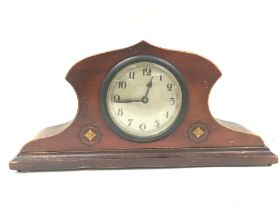 A mahogany mantle clock with art nouveau painted d