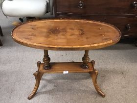 an oval Yew wood occasional table.