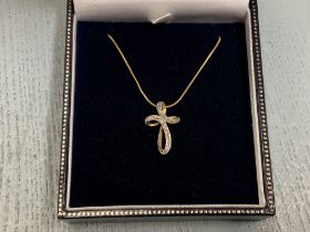 A 9ct gold and diamond set cross and 9ct gold rope chain.