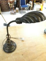 A bronze shell art deco lamp, 67cm tall.