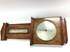 A vintage barometer. 72cm by 30cm