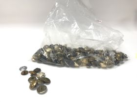 A bag of mixed military buttons.