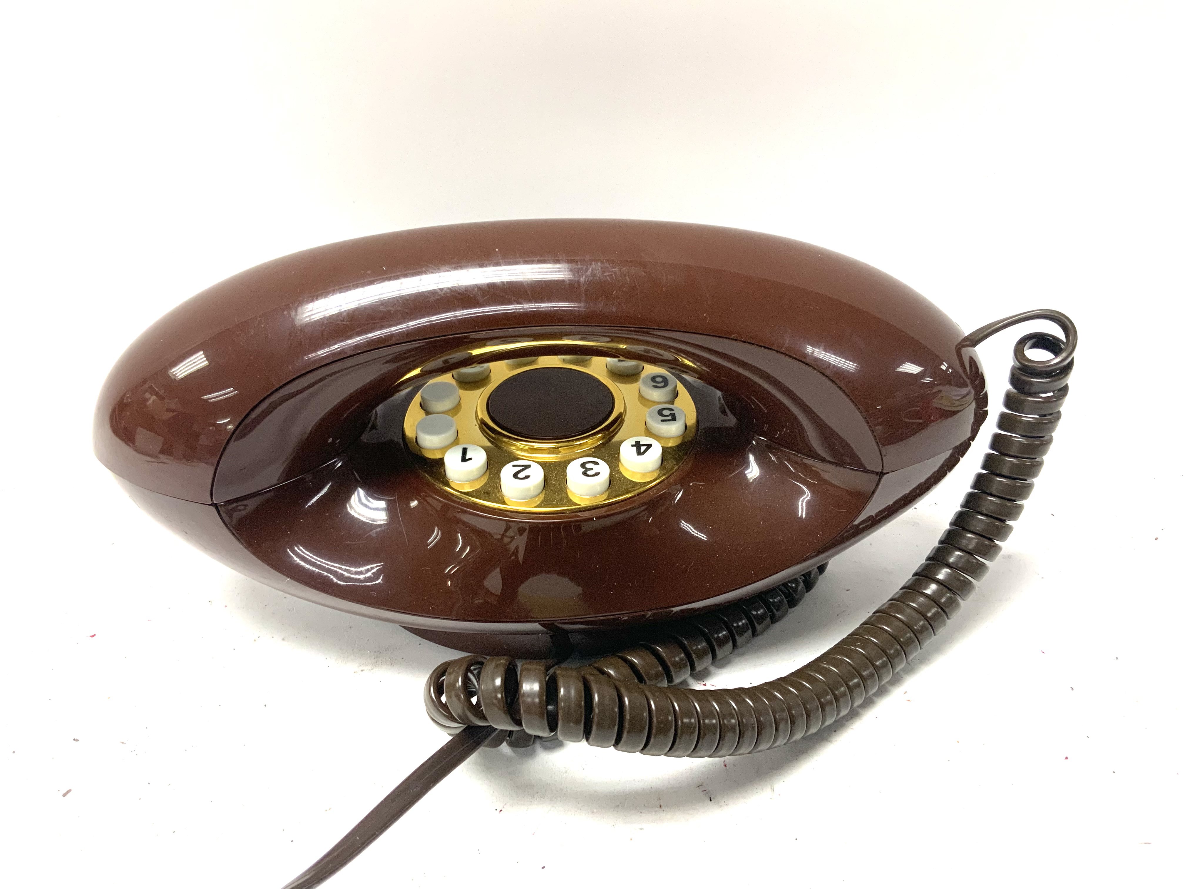 A vintage 8022A corded telephone. (B)