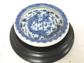 A small Chinese export blue and white dragon dish.