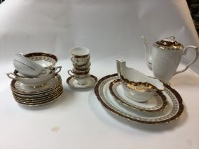 A Large royal Stafford bone china dinner set. Including cups, saucers, side plates, serving