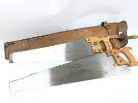 A pair of saws in a leather case, saws consist of