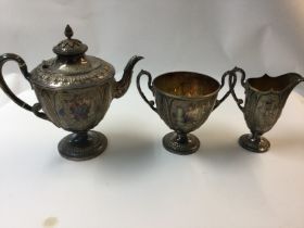 A Victorian piece silver plated tea service with ornate decoration.