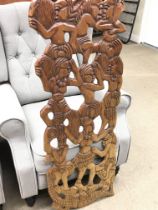 A hand carved wooden African tribal art wall piece