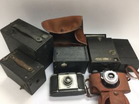 A bag of vintage cameras and accessories. Shipping category D. NO RESERVE.