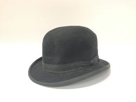 A vintage Black bowler hat.