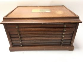 wooden coin collectors cabinet.
