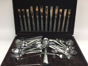 A canteen of stainless steel cutlery.