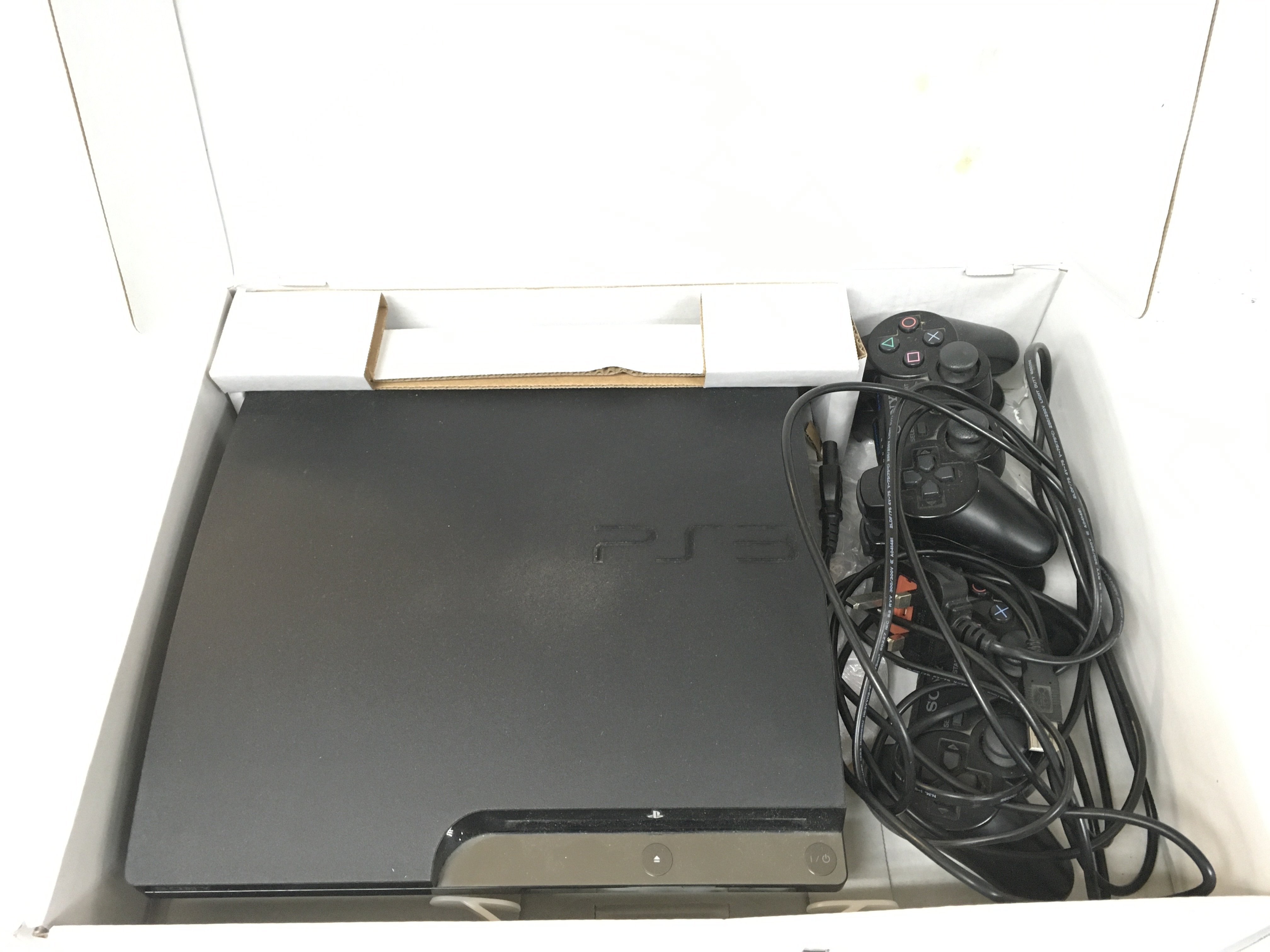 Sony PlayStation 3 with controllers, with a collec
