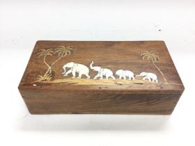 An Indian rosewood box inlaid with elephants, appr