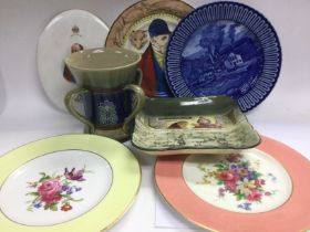 Four Royal Doulton items comprising a loving cup, two plates and a dish plus two Royal Worcester