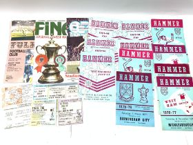 A collection of West Ham football programs and tic
