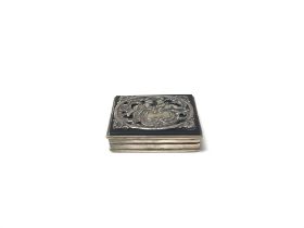 A small sterling silver pill box. (A)