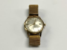 A 9ct gold gents automatic Garrard wristwatch, (A)