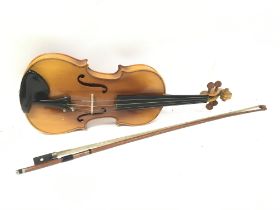 A cased Lark violin , 56cm long. Postage category