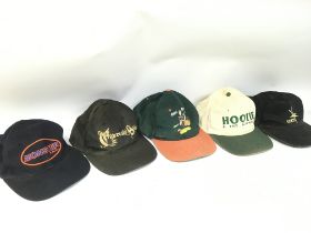 A Collection of vintage 90s hats including Cypress