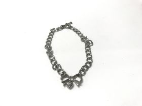 A Modern Juicy Couture fashion necklace linked wit