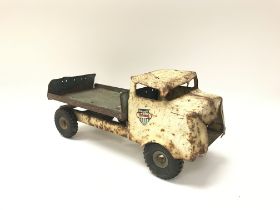 A vintage tin plate toy truck.