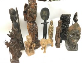 A collection of carved wooden African tribal figur