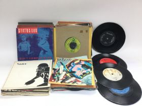 A box of LPs and 7inch singles by various artists including Deep Purple, Elvis Presley, Status Quo