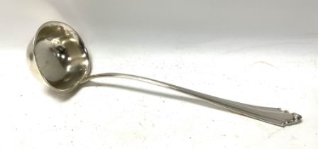 A sterling silver ladel, German marks 800. Later white metal bowl. (B)