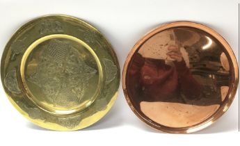 Two circular trays - one ornate brass and one copper
