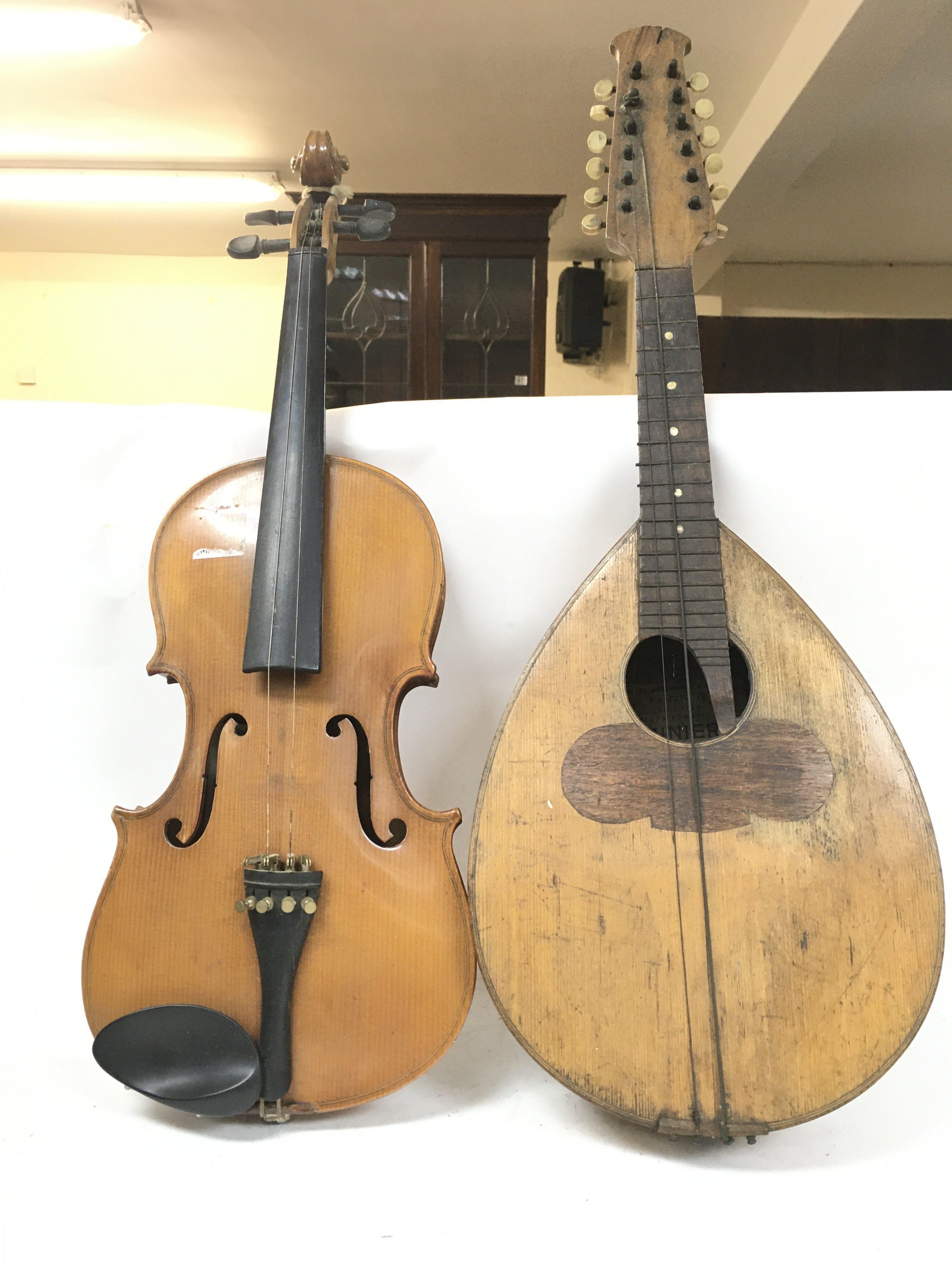 A damaged twelve stringed mandolin by Giovanni Min