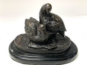 A cast bronze figure group of partridges, indistic