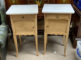 A pair of French marble topped pot cabinets