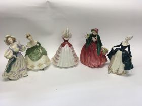 A collection of five royal Doulton lady figures.