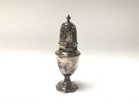 A hallmarked silver sugar caster. 20cm.